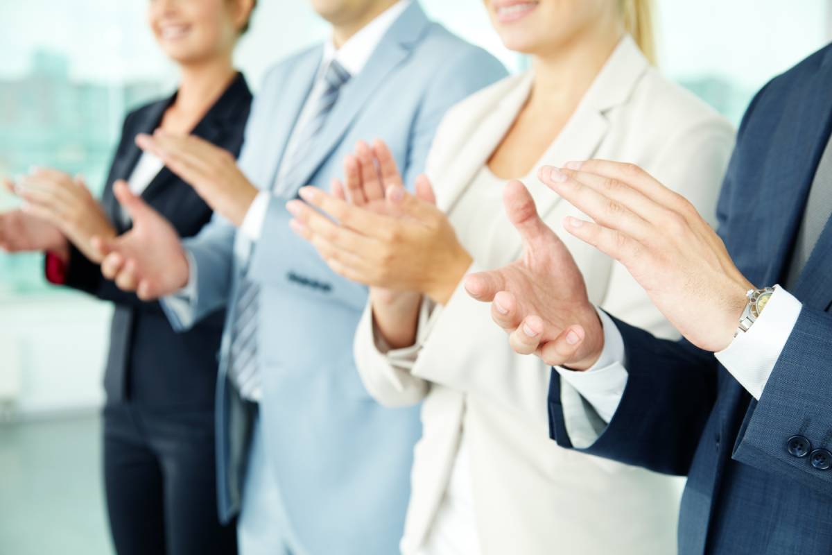 Business people clapping in appreciation